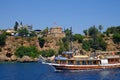 ANTALYA, TURKEY - JULY 0Ã¢â¬Â­4Ã¢â¬Â¬ 2019: View on the HÃÂ±dÃÂ±rlÃÂ±k Tower and a touristic boat in Antalya